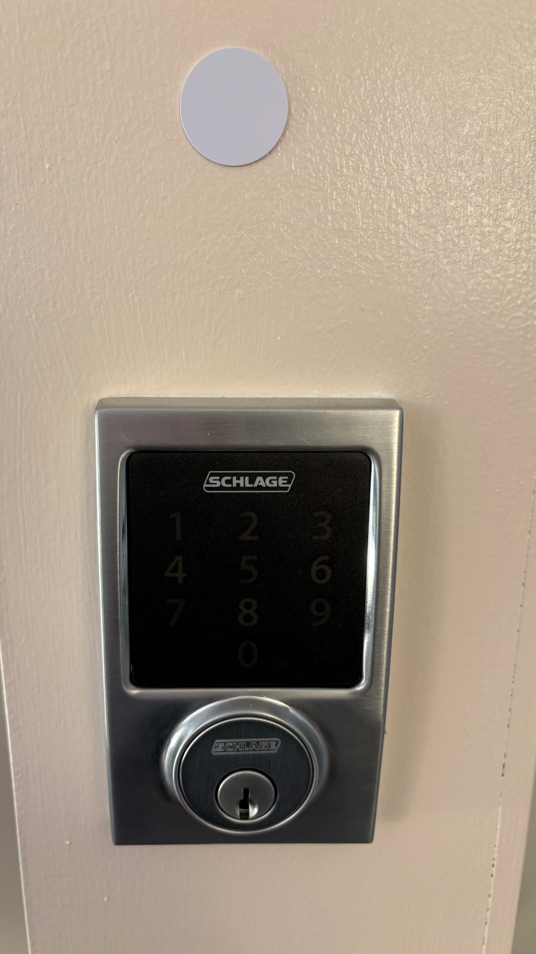 Image of Z-Wave enabled Schlage lock with NFC tag affixed above it